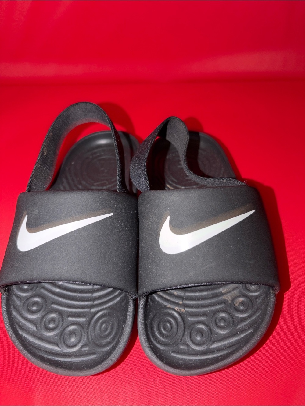 Nike Kids Black Slide Sandals with White Swoosh Accent